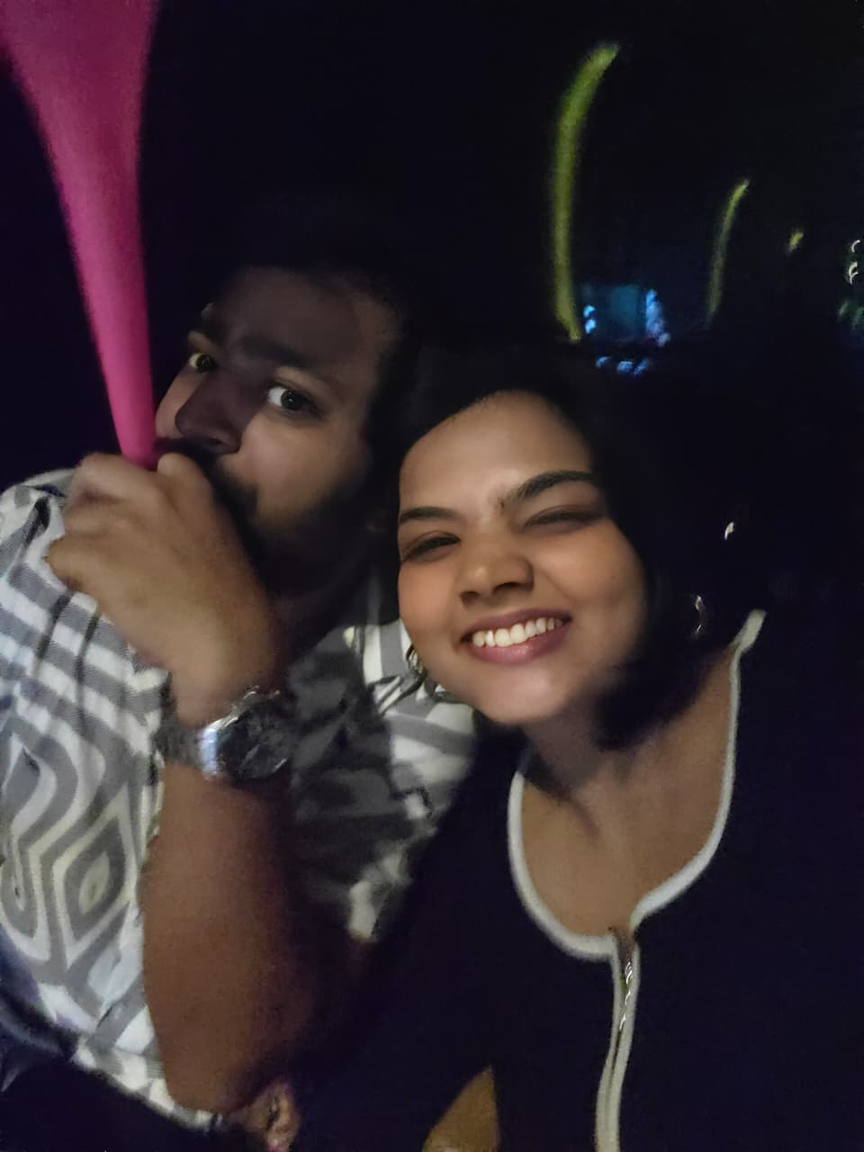 The couple against a scenic background